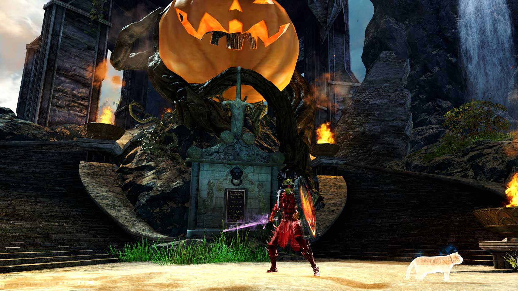 Gothic Sans standing in front of the PvP memorial plaque, which is now adorned with a giant jack o'lantern.